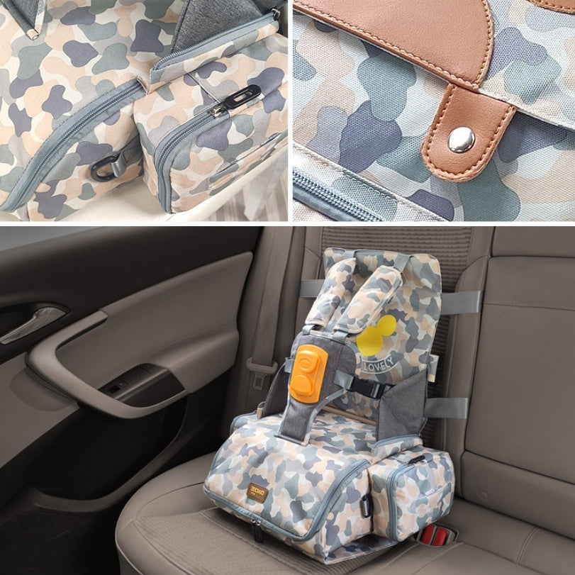 Camouflage-patterned child safety seat and bag with car seat attachment on a car's back seat.
