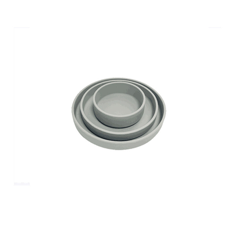 Set of three gray ceramic bowls on a white background