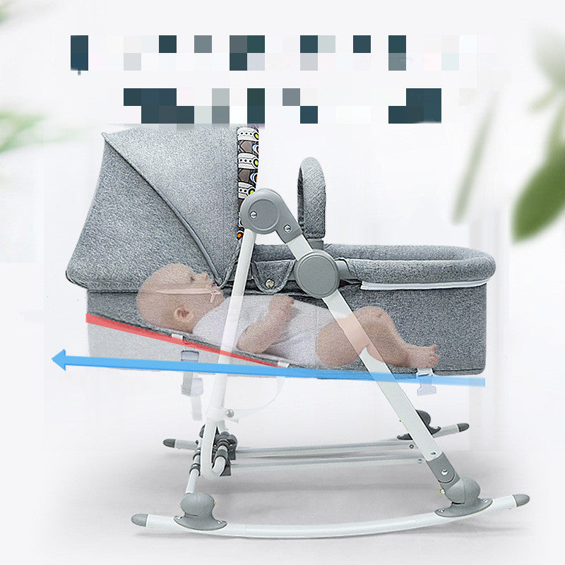 Baby in a gray baby bouncer with a white background