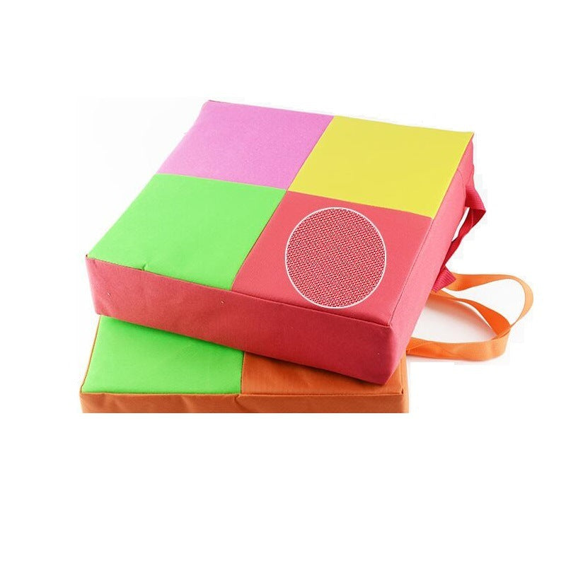 Colorful foam mat with a speaker on a white background