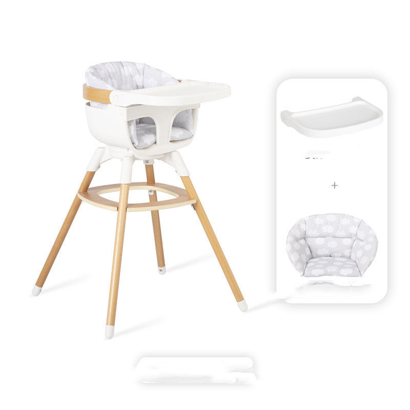 White high chair with wooden legs and a baby seat cover on a white background