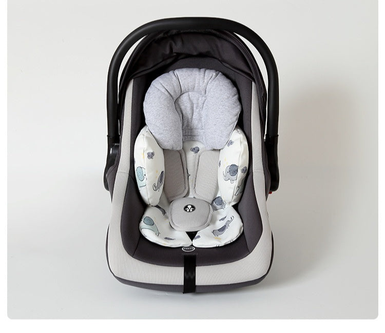 Baby car seat with gray and white patterned cover on a white background