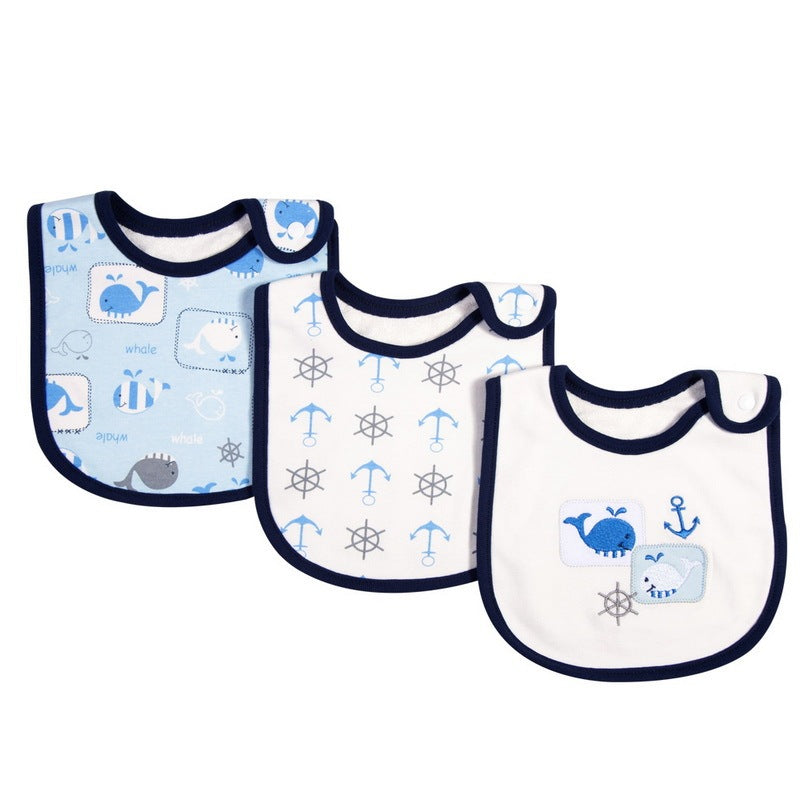 Three baby bibs with nautical patterns on a white background