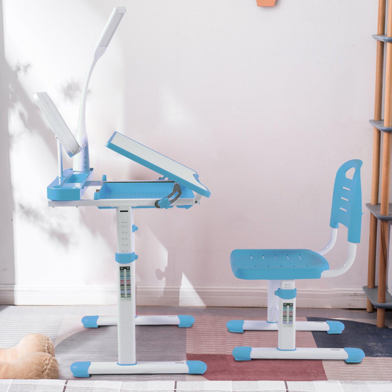 Children's study desk and chair set with adjustable height in a room setting.