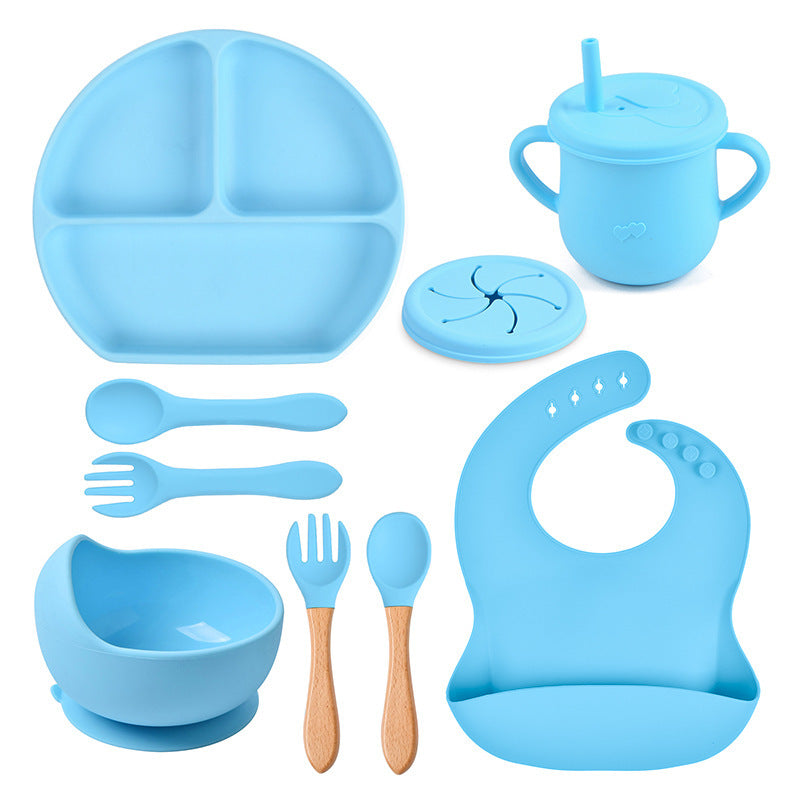 Blue silicone baby吃饭 set including plate, cup, bowl, utensils, and bib on a white background