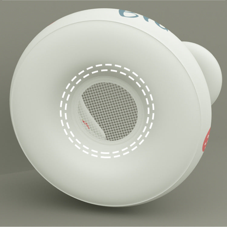 Close-up of a white smoke detector on a gray background