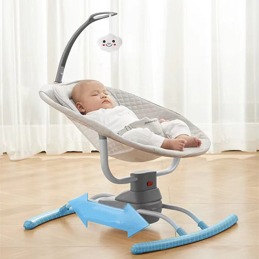 Baby in a gray and blue baby swing with a white curtain background