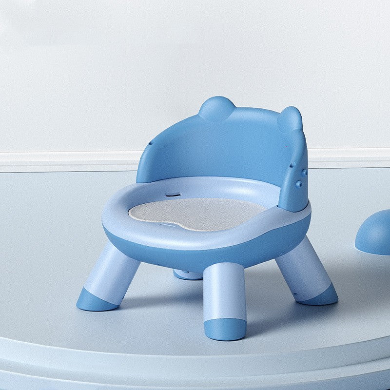 Blue children's potty chair on a light gray background
