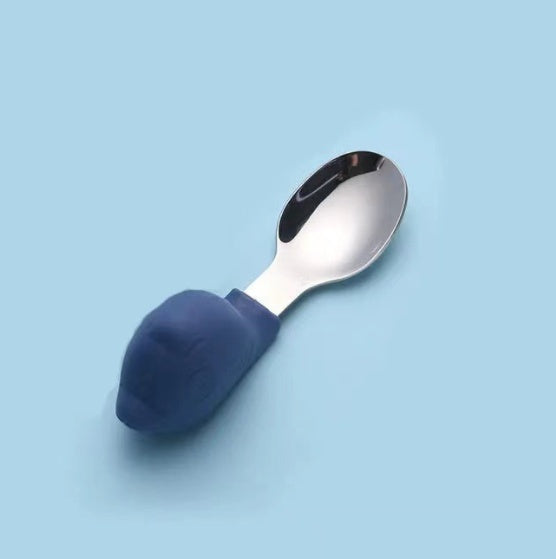 Spoon with a blue handle on a light blue background