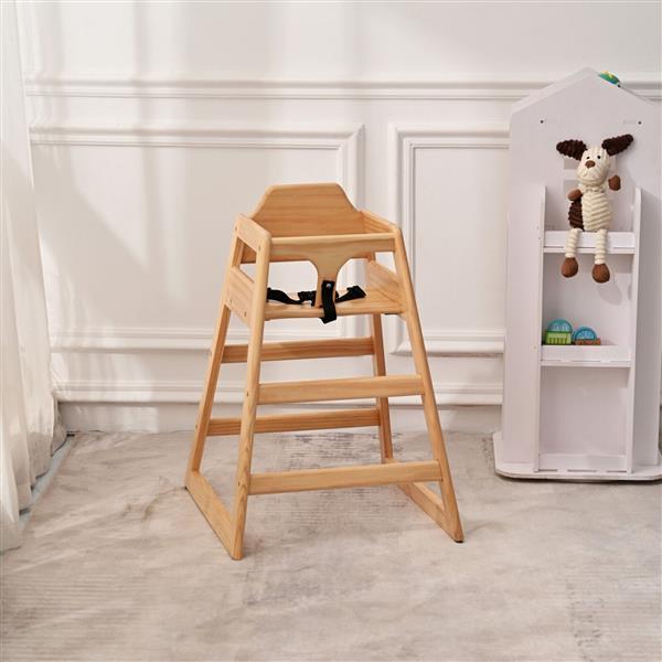 Wooden high chair in a room with a white wall and a shelf with toys.