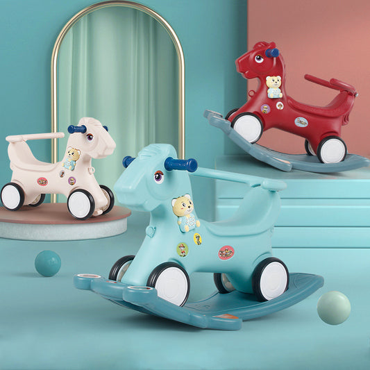 Three colorful children's toys on a teal surface with a mirror and pink wall in the background.