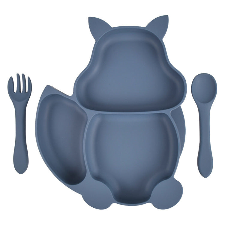 Blue silicone dining set with bowl, cup, spoon, fork, and bib on a white background