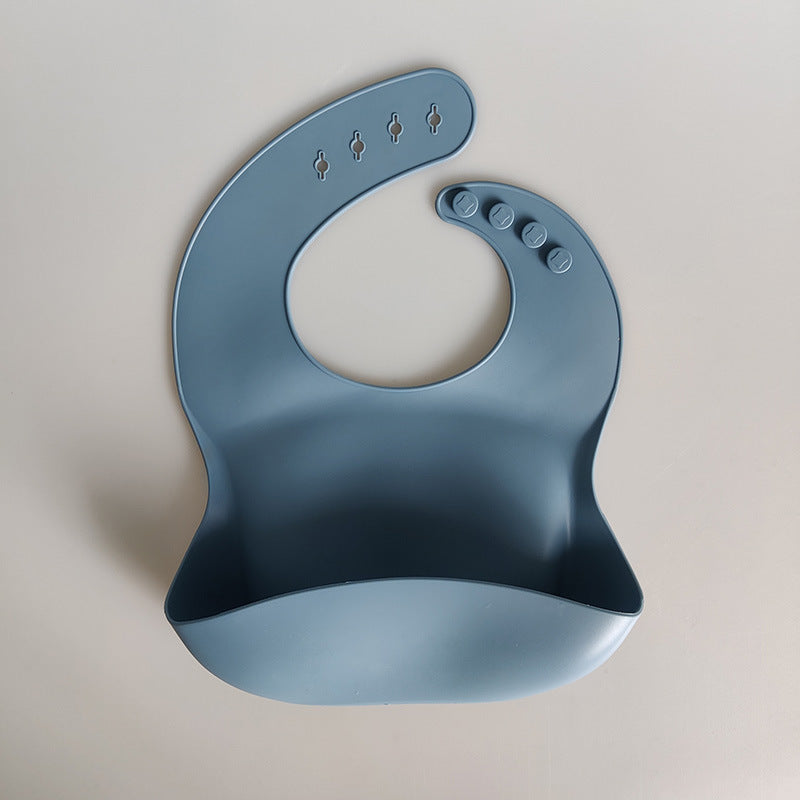 Blue silicone bib on a beige background