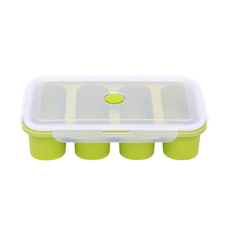 Green and white silicone ice cube tray with lid on a white background