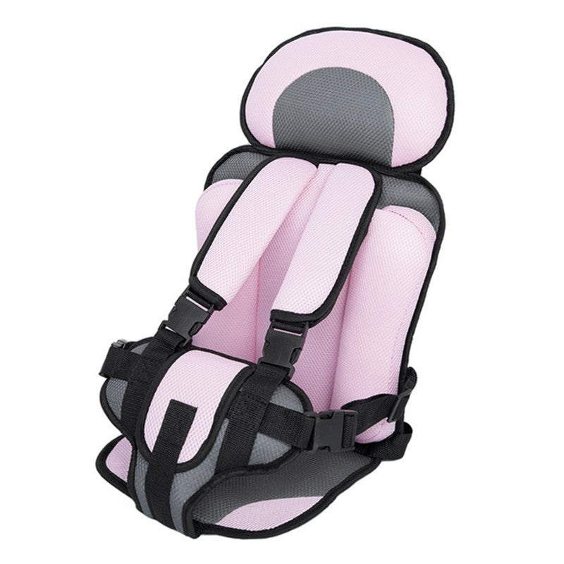 Pink and gray child safety seat on a white background