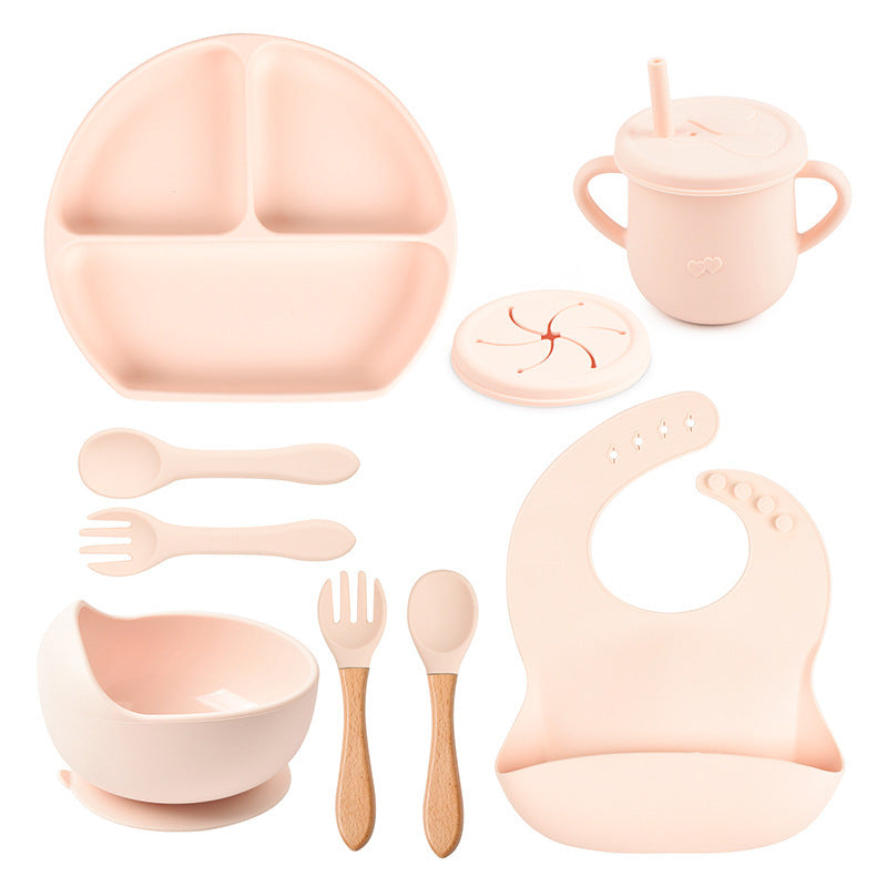 Set of baby吃饭 utensils including plate, cup, bowl, spoon, fork, bib, and straw on a white background