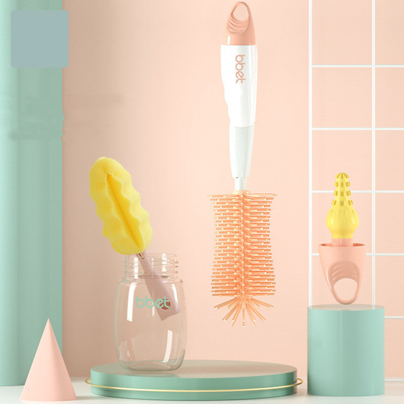 Babystart bottle cleaning brush set with a glass container and yellow sponge on a pastel background