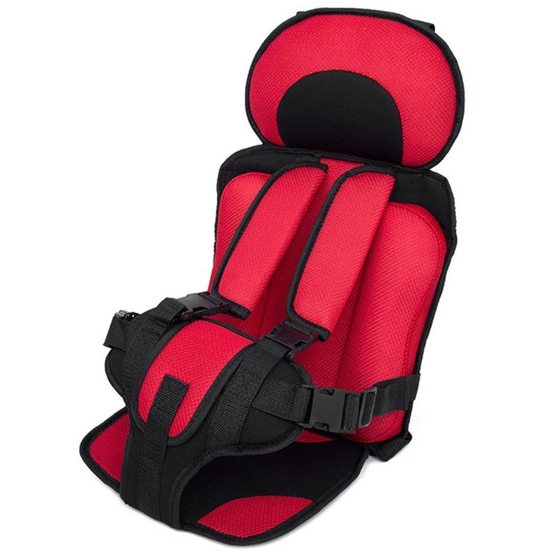 Red and black child safety seat on a white background