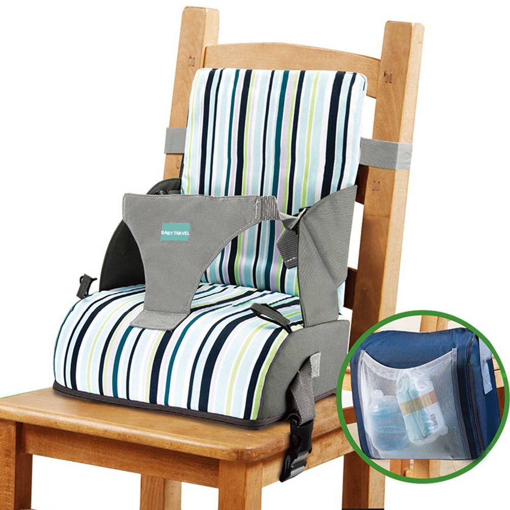 Baby high chair with striped cushion and gray straps on a wooden chair, with a close-up of a pouch containing bottles.