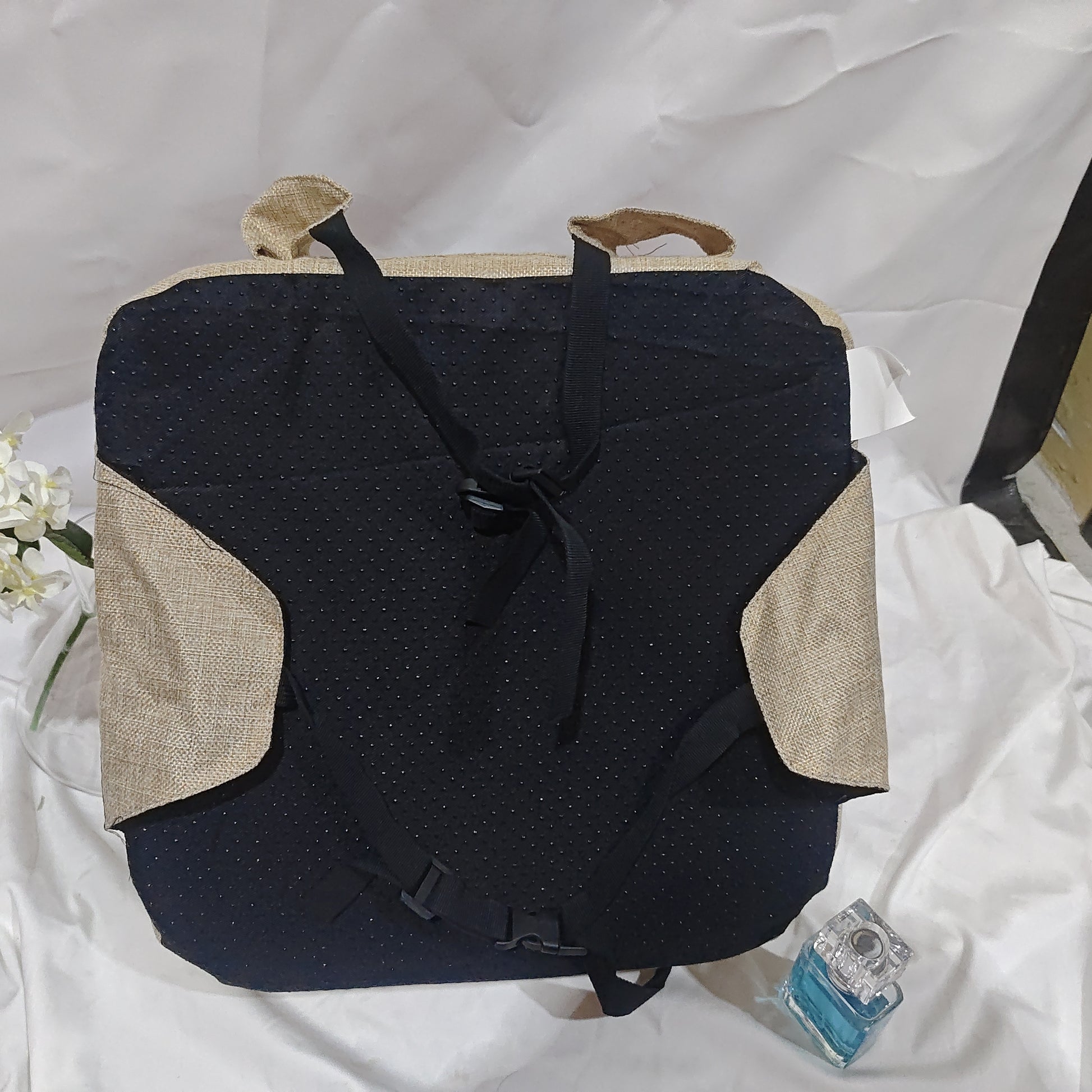 Black and beige backpack on a white background