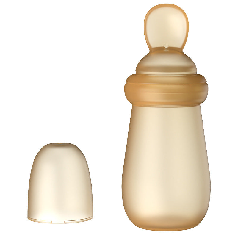 Two beige baby bottles on a white background