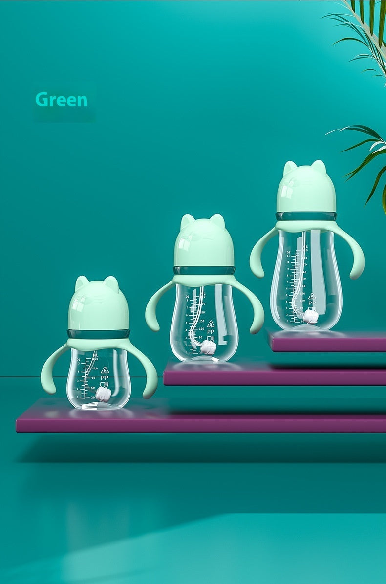 Set of three green baby bottles with cat designs on a teal background