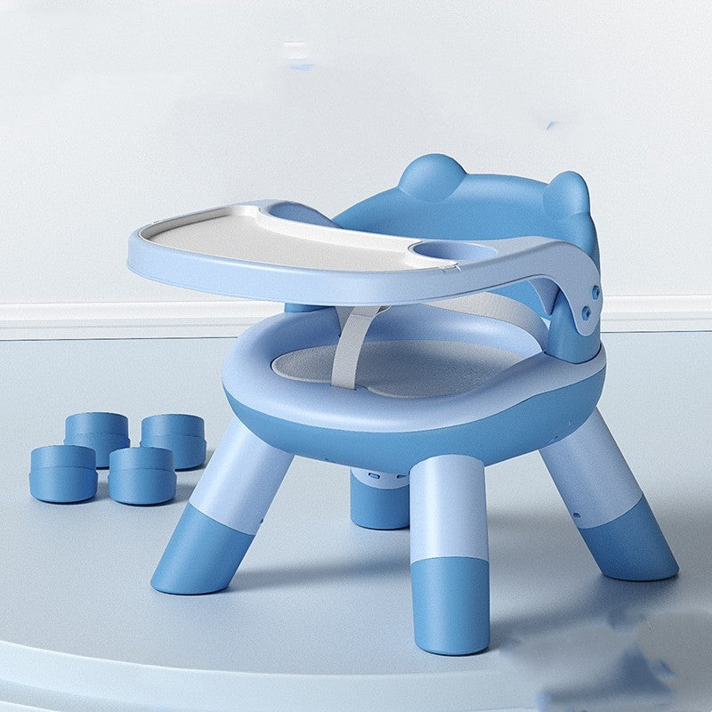 Blue children's chair with a tray on a light blue background
