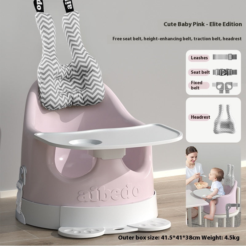 Pink baby high chair with various safety features and a child using it.
