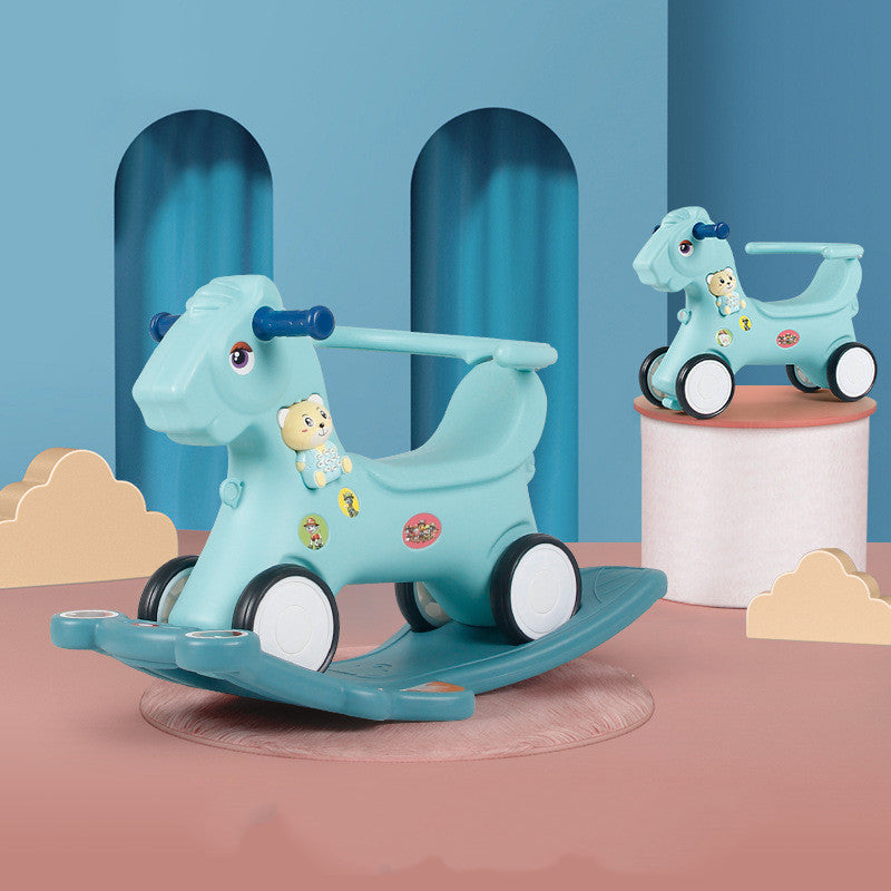 Children's toy horse with wheels on a blue and pink background