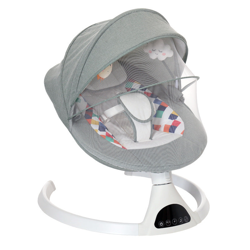 gray baby bouncer with colorful diamond pattern on a wooden floor.