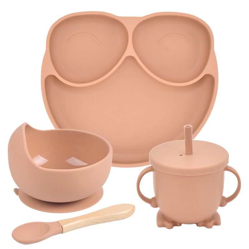 Set of pink silicone dining utensils including a bowl, cup, spoon, and tray on a white background.