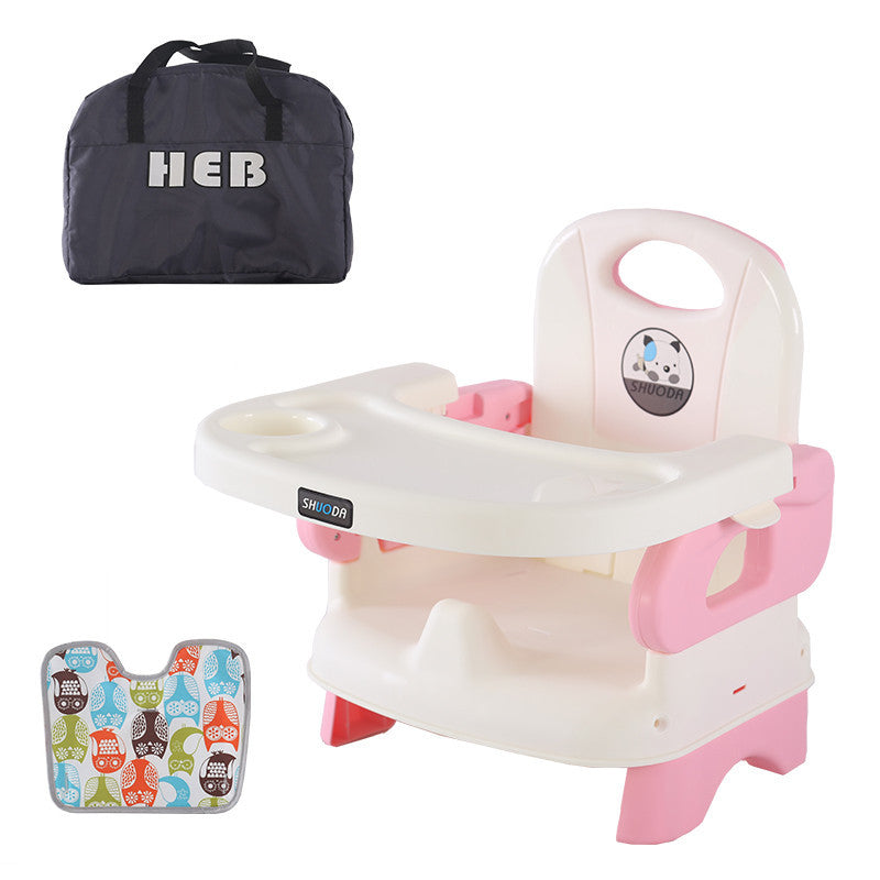 Pink and white baby seat with a black bag labeled 'HEB' on a white background