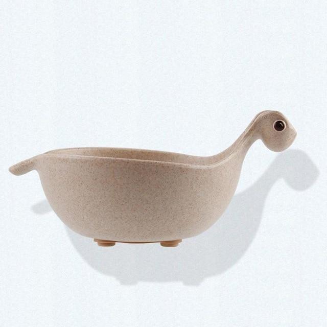 Beige ceramic bowl shaped like a duck on a white background