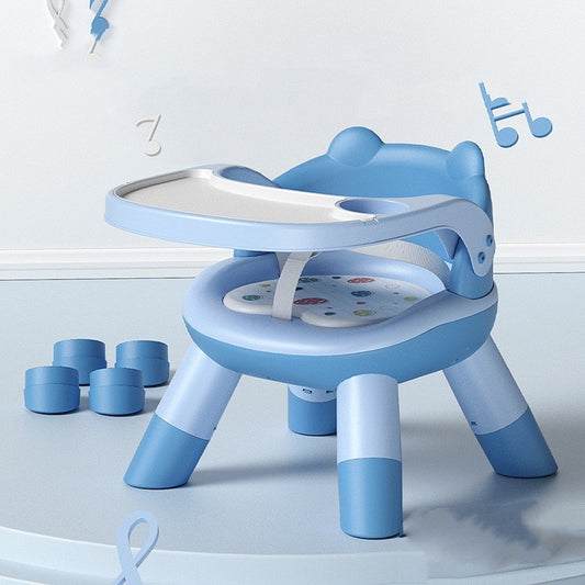 Blue children's chair with attached table on a light blue background
