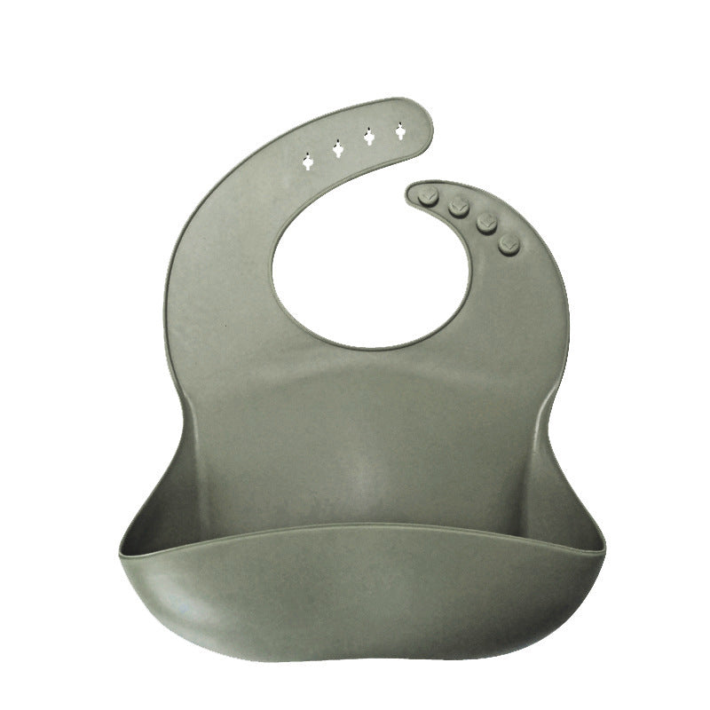 Green silicone bib on a white background