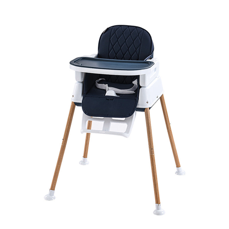 Baby high chair with black cushion and wooden legs on a white background