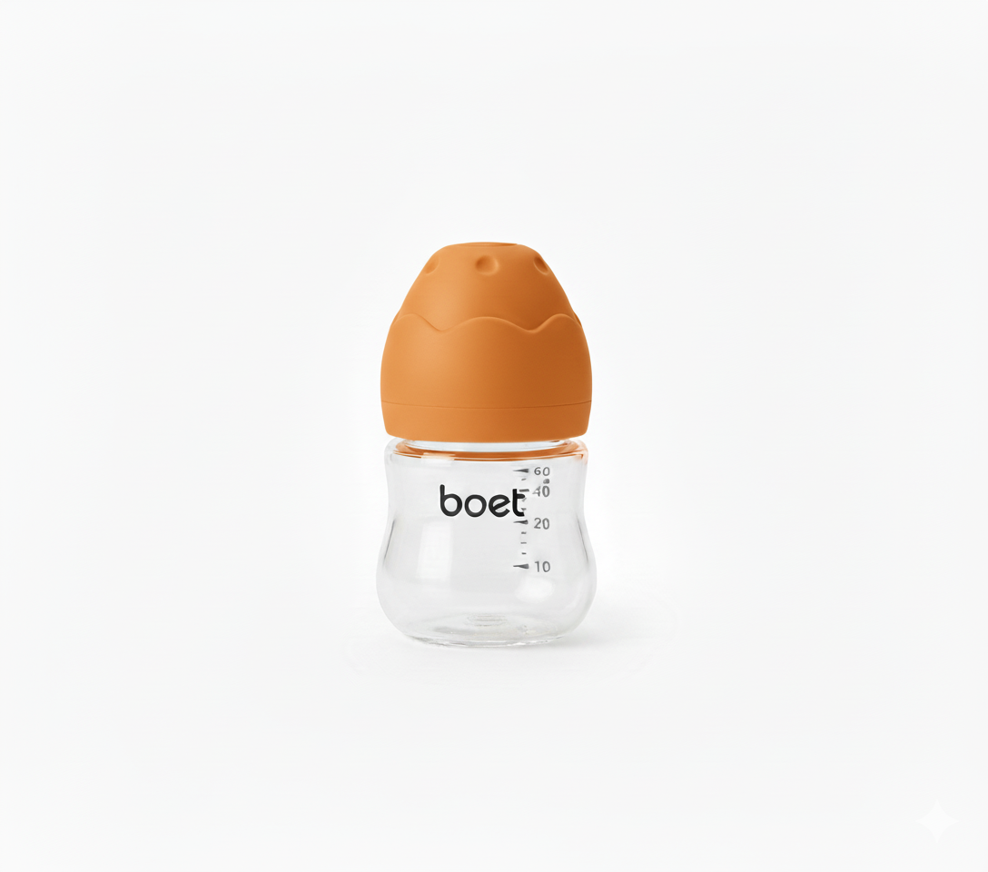 Baby bottle with orange cap and 'boet' branding on a white background