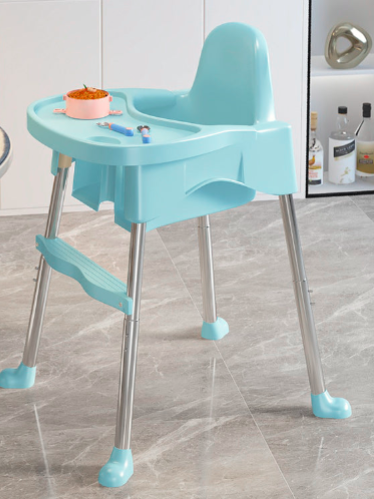 Blue baby high chair with tray on a tiled floor