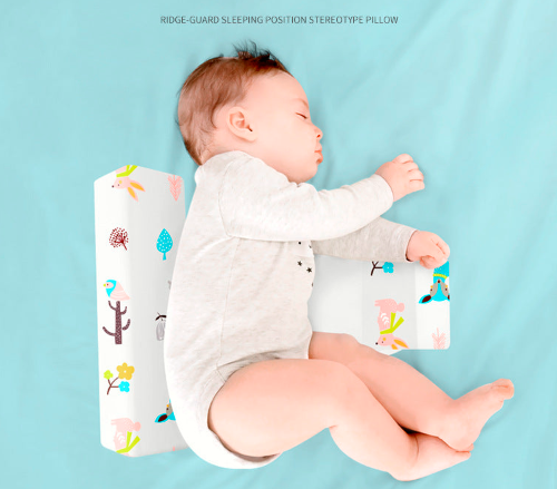 Triangular washable side sleeping pillow for babies with colorful animal print by Nestacular.