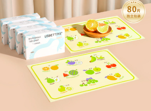 Oil-proof disposable baby placemats in Fruit Paradise design, featuring colorful fruit illustrations, by Nestacular.