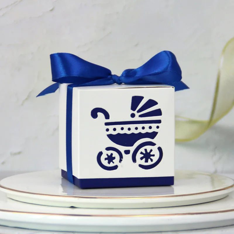 White gift box with blue ribbon and baby carriage design on a white background