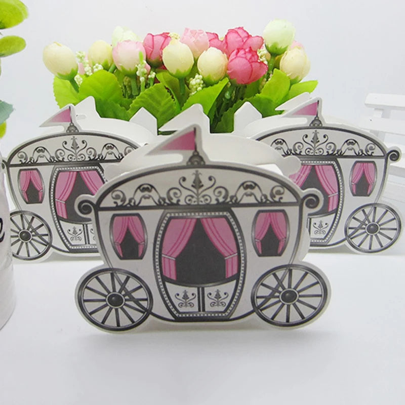 Decorative carriage-shaped items with pink curtains on a white background