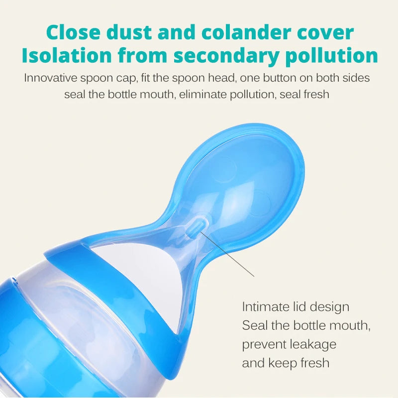 Blue baby bottle with spoon attachment on a beige background