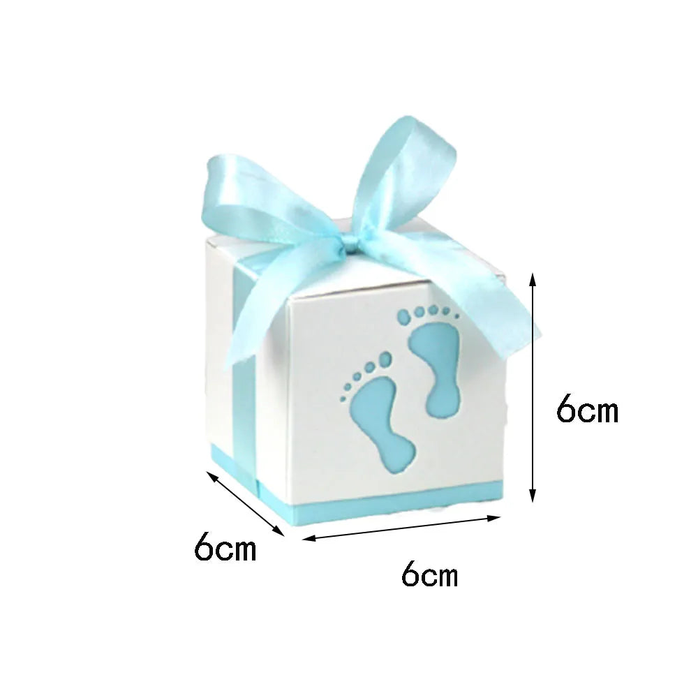 White gift box with blue ribbon and footprints, showing dimensions on a white background