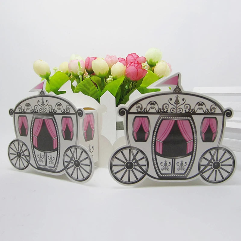 Two decorative carriages with pink curtains on a white background, accompanied by a small bouquet of flowers.