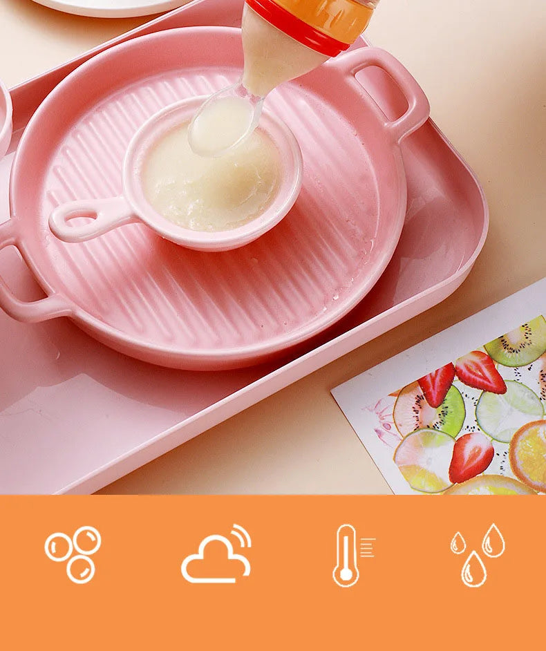 Pink baby food preparation set with a bowl and spoon on a light background