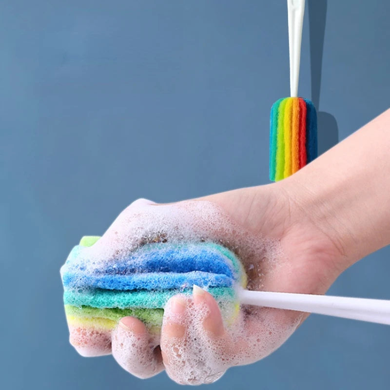 Hand holding a rainbow-colored scrubber with a blue background