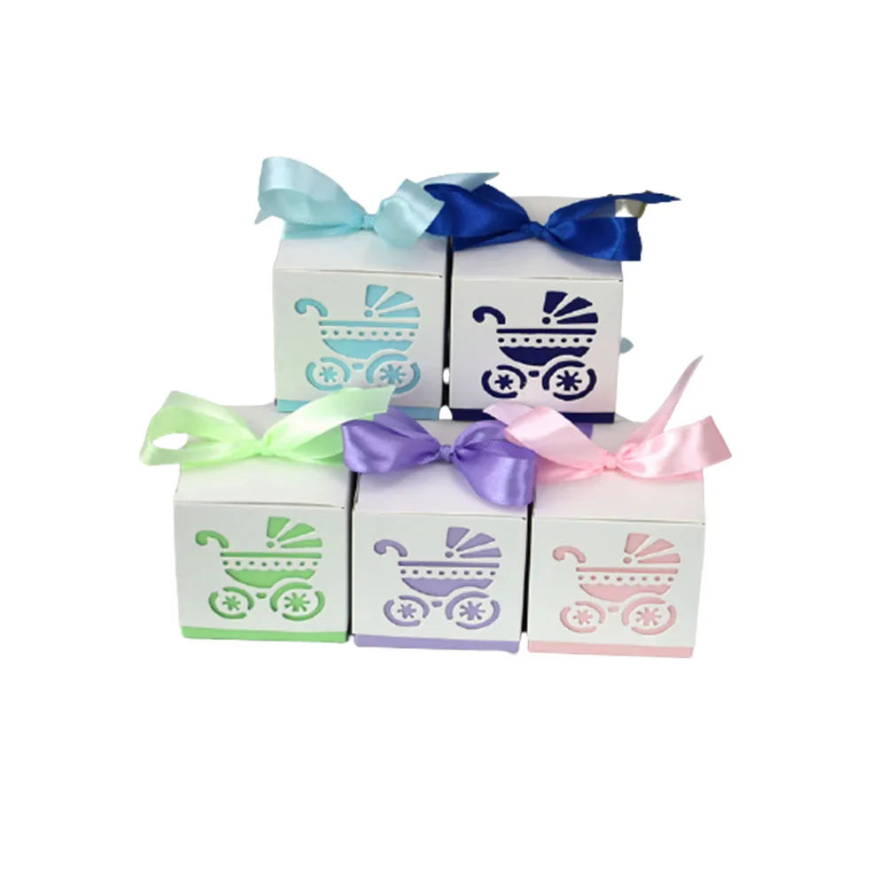 Set of four decorative boxes with baby stroller designs and colorful ribbons on a white background