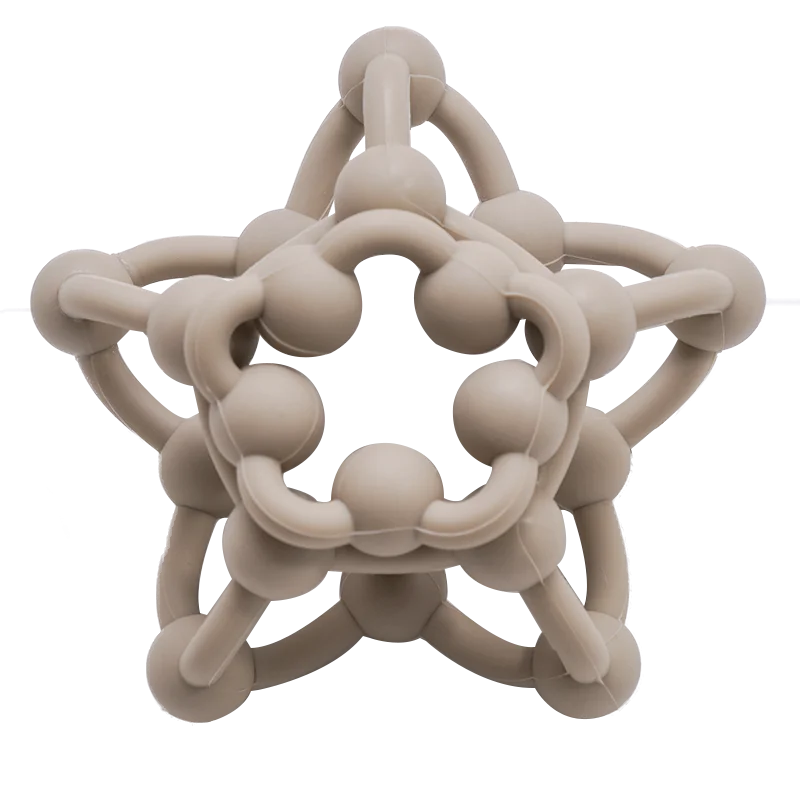Beige star-shaped object with interlocking rings on a white background