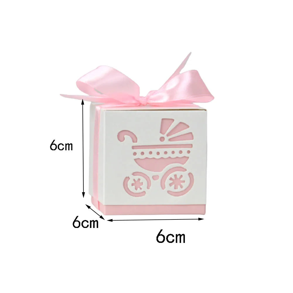 Small white box with pink baby carriage design and bow, measuring 6cm on each side.
